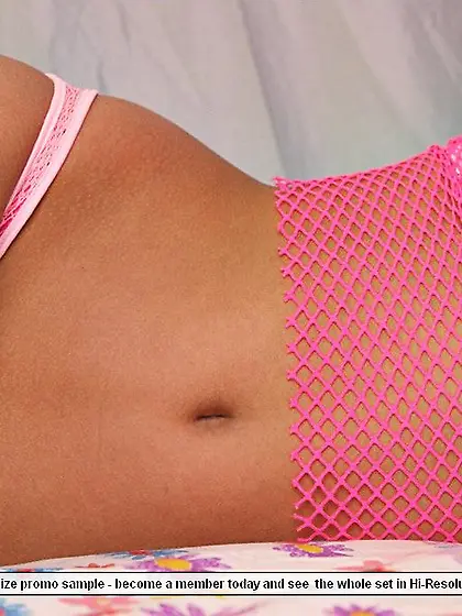 Foxy blonde babe Kari Sweets teases us on the bed wearing pink f