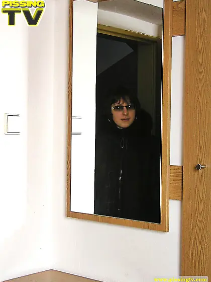 Teen pissing in a hallway