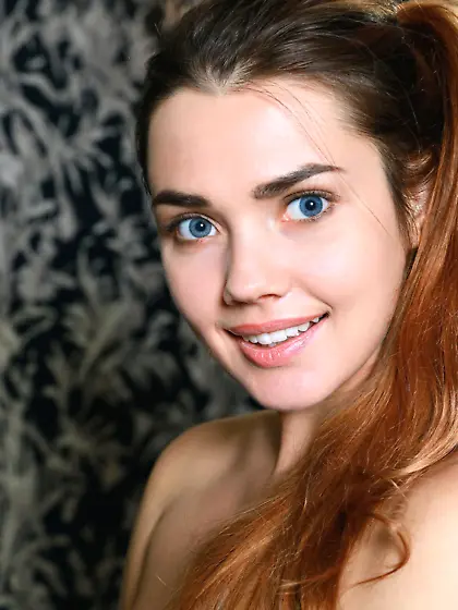 Blue-eyed gamer girl loves her blue DualShock,  loves getting on