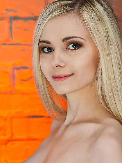 Innocent blonde Lenore poses like a porcelain doll to show her s