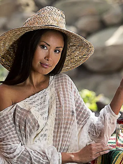 Oriental young woman looks pretty cute in her simple outfit that