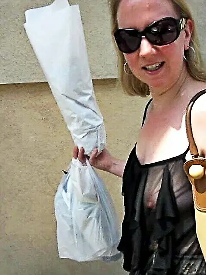 In a frilly black top on the street