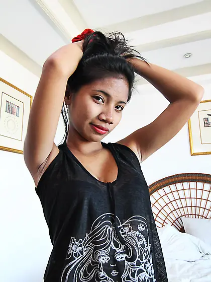 Gorgeous young woman from the Philippine Islands passionately ge