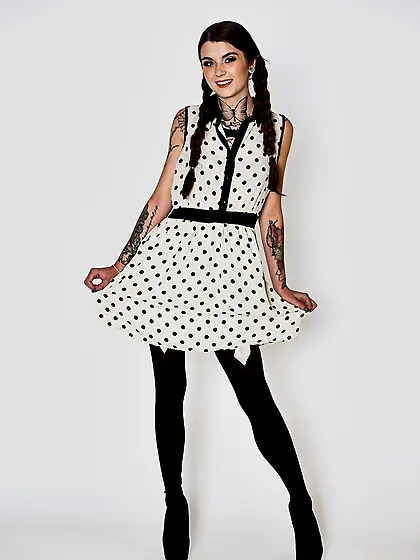 Woman with two pigtails puts her smooth buttocks and pussy right