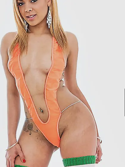 Athletic ebony with a fat ass is wearing stocks while sucking co