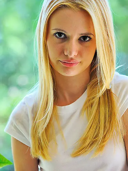 Slim blonde with a tiny waist shows her perfect nude body outdoo