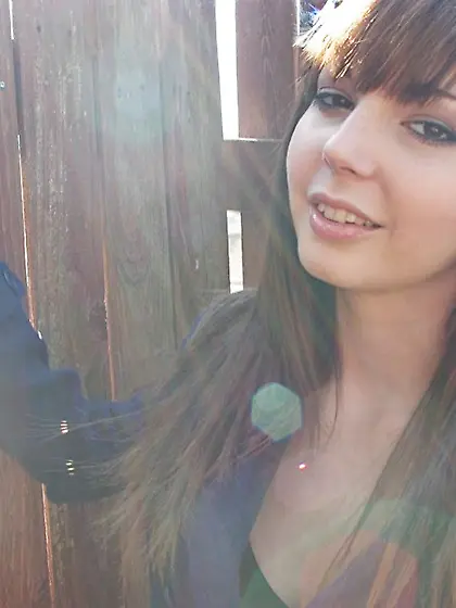 Busty brunette Ivy Jean slides her panty down to the knees and r