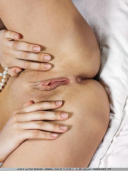 Licentious blonde teen Lada D in stockings spreading legs as wid