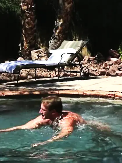 Hands rub smooth chest