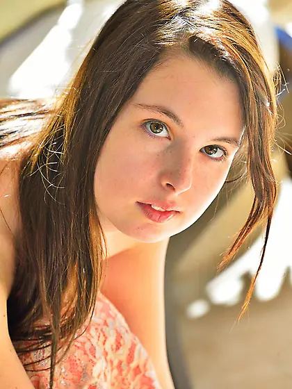 Girl in beautiful dress Aeris FTV is sitting on armchair with pu