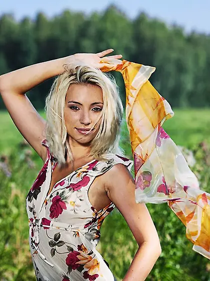 Excitable blonde posing outdoors and showing her delightful ass