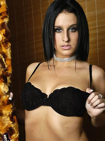 Raven haired chick Hottie Hollie takes off her black bra to show