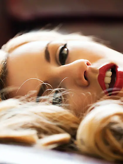 The black erotic lingerie does not hide the nude charms of lewd