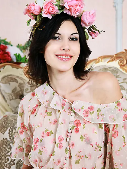 Lovely babe sits gray