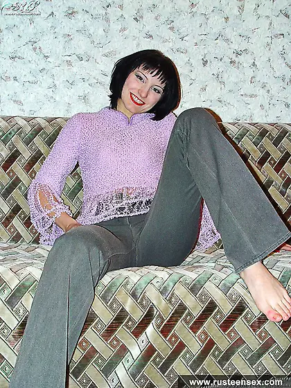 Teen brunette posing and showing shaved pussy