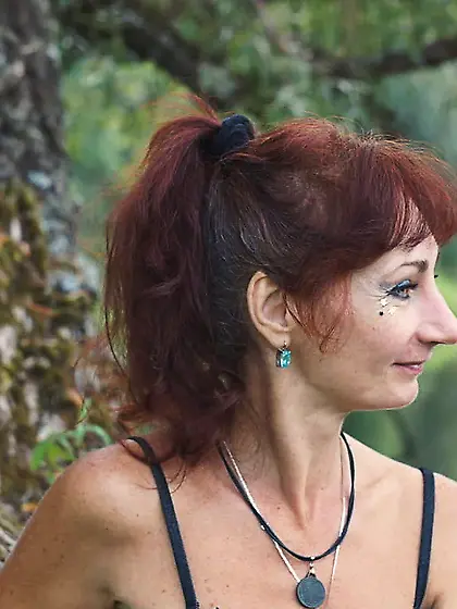 Black bikini near tree upon river