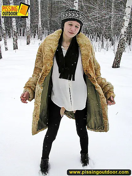 Pissing outdoor in the snow in winter day
