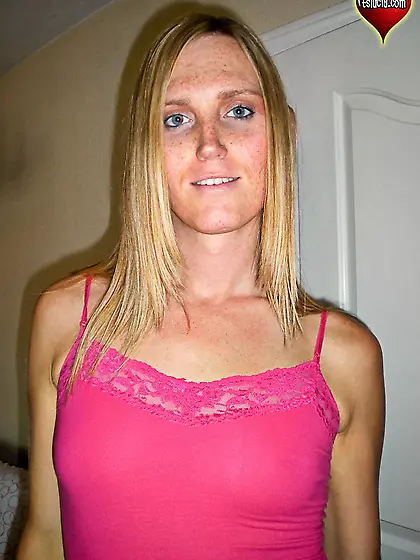 Blonde shemale plays with a dildo