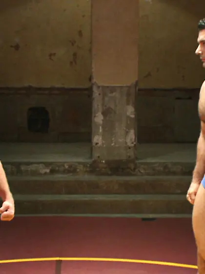 Muscular dudes battle wrestle