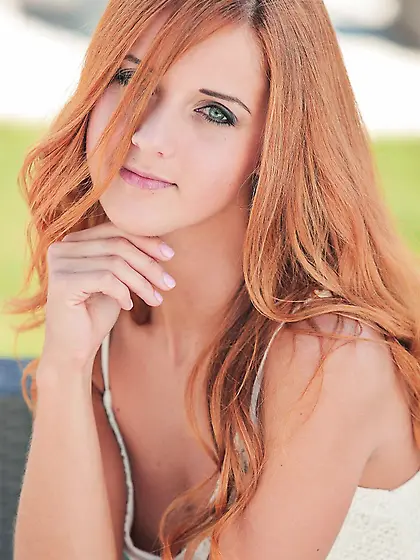 Luscious redhead Roberta Berti exposes her tight body and tiny t