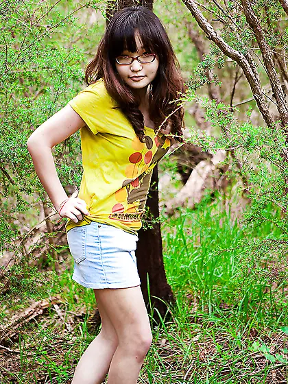 Adorable girl from Asia shows her firm backside as well