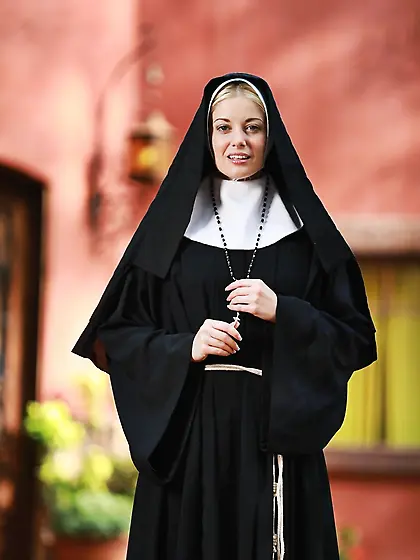 Slender blonde nun provocatively shows small tits and cunny hidd