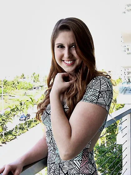 Pretty redhead revealing top