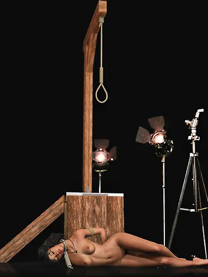 The dead body of a girl hanged in a photo studio