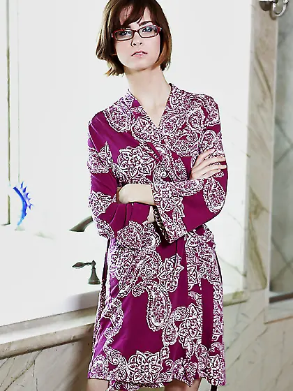 Love in violet robe and underwear takes her glasses off and show