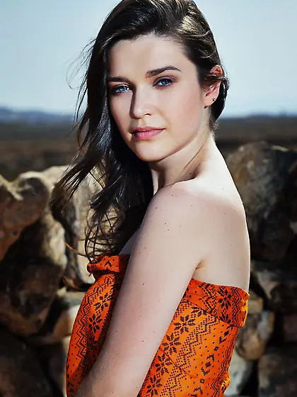 Pale-skinned brunette strips naked and poses artistically by the