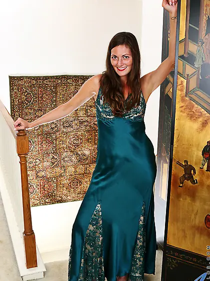 Attractive woman peels off long dress and shows her slim body wi