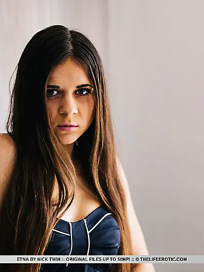 Sultry brunette smokes cigar