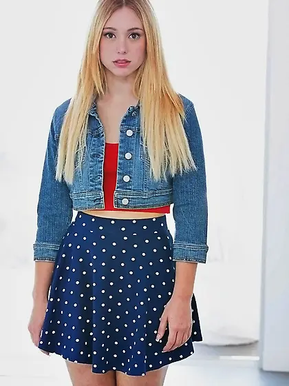 Lucy Tyler demonstrates her shaved pussy and tight ass