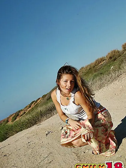 Cute teen gal Emily 18 takes off her dress outdoors and shows he