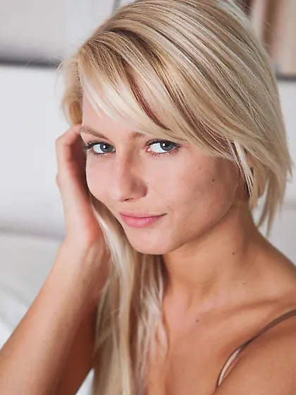 Blonde angel Pinky June lets everybody see her soft shaved pussy