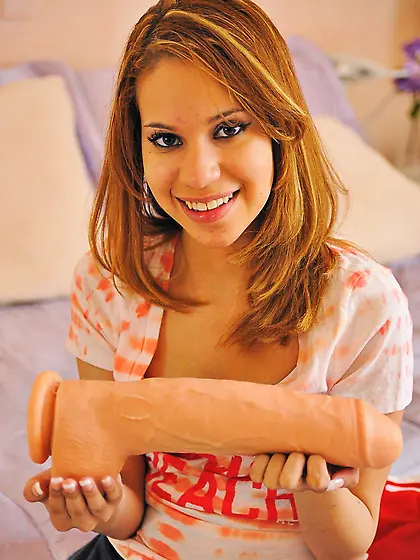 Adorable solo babe showing her stripping skills for the camera