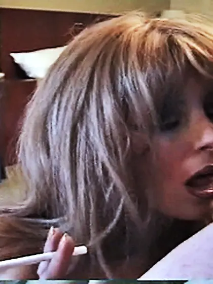 While she smokes she loves to swallow a big...