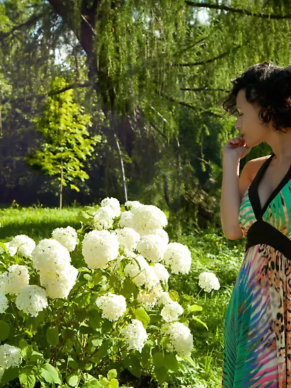 Short-haired and curly brunette flaunting her hairy pussy on a c