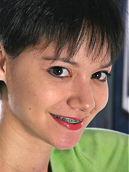 Short haired brunette Suzanne Martinez in sneakers exposes her b