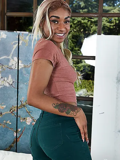 Ebony teen with a fair pigtail pleases fans with naked titties a