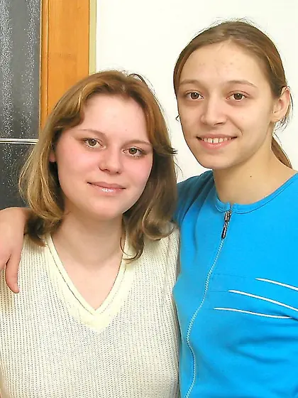 Lesbians pissing from a chair