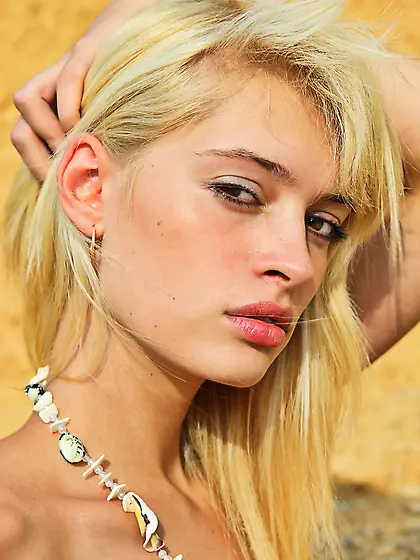 Teen beauty Ivetta A enjoys displaying her curvy body on the bea